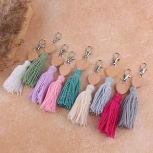 Bohemian style handmade beech wood heart cotton tassel keychain bag charm detailed view.