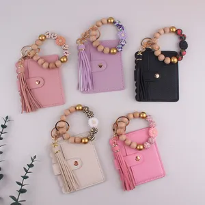 Porte-cartes en cuir PU porte-clés bracelet avec perles en bois et charmant pompon