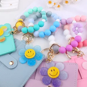Silikon Perlen Armband Schlüsselanhänger mit süßem Smiley Blumen Kartenhalter für den Alltag.