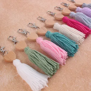 Bohemian wooden heart cotton tassel keychain and bag charm, stylish colorful accessories.
