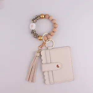 Porte-Clés Bracelet en Silicone et Bois Fait à la Main Avec Porte-Cartes en Cuir PU Pendentif Marguerite Gland Cadeau Mode pour Femmes