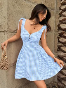 Charming blue and white gingham summer dress with delicate straps and waisted silhouette