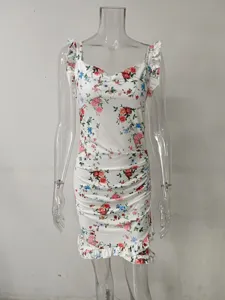 Detailed view of floral print sleeveless dress with ruffle trim and ruched bodycon fit