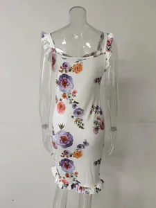 Close-up view of white floral print bodycon dress with ruffled hem and sleeveless design