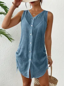 Detailed view of the blue cotton sleeveless button-up cover-up showing fabric texture