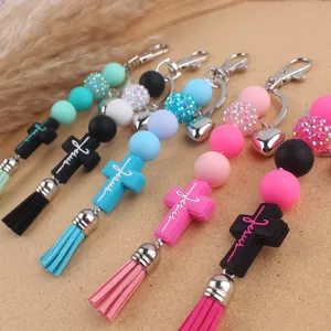 Silicone beaded cross keychain with tassel, cute aesthetic bag pendant, stylish accessories.