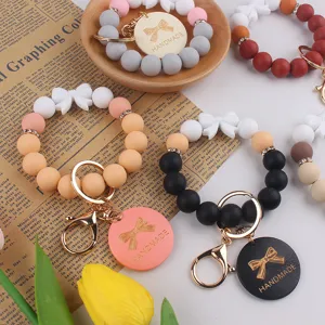 Silicone bead wristlet keychain with bow charm handmade gift for women and girls use