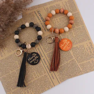 Porte-clés Bracelet en Perles de Silicone Fait Main Avec Signe en Bois Et Pompon en Cuir Cadeau Fête des Mères Accessoire