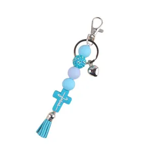 Blue silicone bead cross keychain with tassel and heart charm, stylish bag pendant accessory