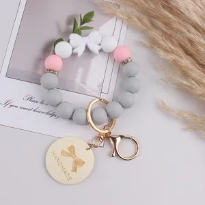 Silicone bead keychain with bow, cute handmade wristlet keyring for women and girls.