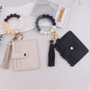 Porte-clés bracelet en perles de silicone avec portefeuille porte-cartes en cuir et pompon