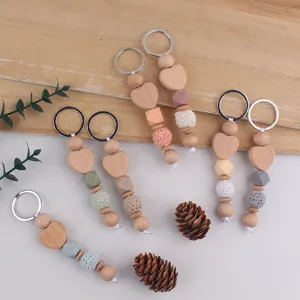 Handmade wooden heart keychains with crochet and silicone beads, cute bag charms for daily use.