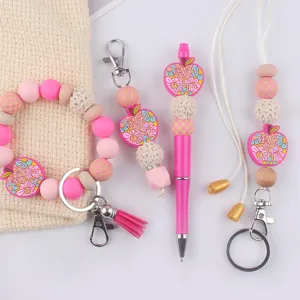 Teacher silicone bead keychain lanyard pen set pink four piece wristlet accessory gift.