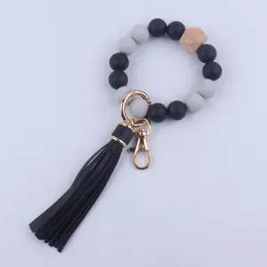 Llavero de pulsera de cuentas de silicona con borla de cuero y cuenta de madera mujer