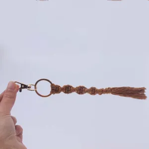 Handmade woven cotton macrame keychain with gold clasp, chic boho key ring pendant accessory.