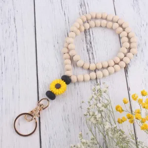 Holzperlen Sonnenblume Lanyard Detail, Silikon Gänseblümchen Anhänger und Goldverschluss.
