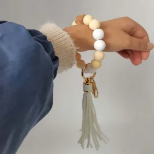 Llavero de pulsera con cuentas de silicona y borla de cuero elegante para uso diario femenino