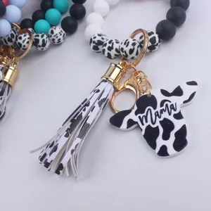 Silicone bead keychain with cow print tassel and Mama charm, perfect gift for mothers.