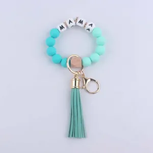 Silicone bead keychain bracelet with MAMA letter beads, wooden accent and chic tassel pendant.