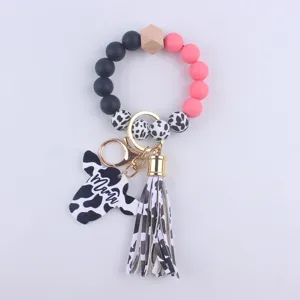 Silicone bead keychain with cow print tassel and mama charm for women and daily use gifts.