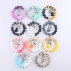 Porte-clés bracelet en perles de silicone avec pompon accessoire de mode élégant et pratique