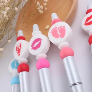 DIY beadable ballpoint pens with cute silicone focal beads, colorful creative stationery items.