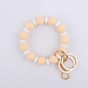 Llavero de pulsera de cuentas de silicona con cuentas redondas y anillos metálicos para mujeres.