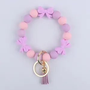 Bracciale portachiavi con perline in silicone con fiocco e nappa simpatici