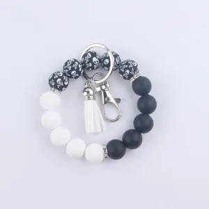 Porte-clés bracelet de perles en silicone avec pompon en cuir et fermoir pour sacs