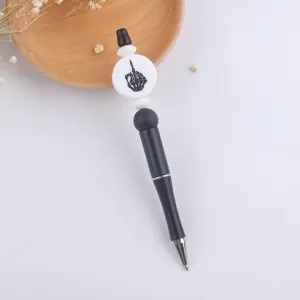 DIY beadable ballpoint pen with black body and unique skeleton hand charm bead, creative.