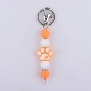 Llavero de cuentas de silicona con cuentas redondas naranja blanco y bonito colgante de pata