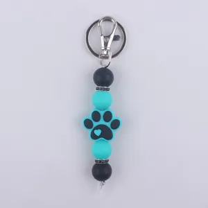 Llavero de cuentas de silicona con colgante de huella de perro, accesorio de bolso.