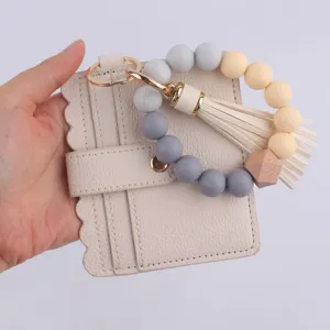 Llavero de pulsera de cuentas de silicona con tarjetero de cuero PU cartera de mujer