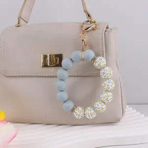 Silicone bead wristlet keychain with floral pattern, perfect bag charm accessory gift.