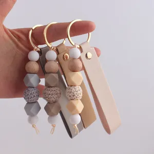 Llavero perline silicone pelle fatto a mano, ciondolo borsa toni neutri accessorio DIY.