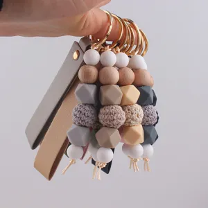 Portachiavi con perline in silicone e pelle fatto a mano, ciondolo borsa elegante chic.