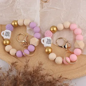 Silikon Perlen Armband Schlüsselanhänger mit Holzperlen und Tassen Anhänger für Tasche und Schlüssel.