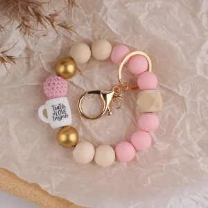 Stilvolles Silikon Perlen Schlüsselanhänger Armband für Lehrer mit schönen Holzperlen.