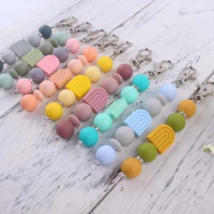 Colorful silicone rainbow beaded keychain DIY accessory with metal clasp for bag and keys.