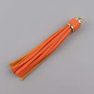 Ciondolo nappa in pelle PU arancione con cappuccio dorato, ideale per borse e fai da te.