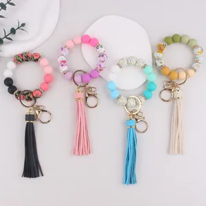 Llaveros de cuentas de silicona con borlas de colores, elegantes pulseras para uso diario.