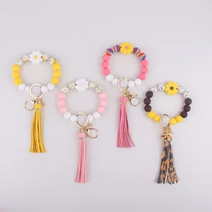 Silikon Perlen Schlüsselanhänger Armband mit süßer Gänseblümchen Blume und Quaste stil.