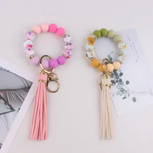 Llavero de pulsera de cuentas de silicona con borla diseño boho elegante para mujeres