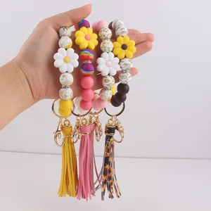Bunte Silikonperlen Schlüsselanhänger Armband mit Blumen Anhänger und Quasten.