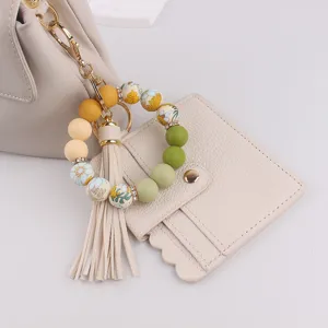 Silikonperlen Armband Schlüsselanhänger mit Leder Kartenetui und Quastenanhänger für Damen.