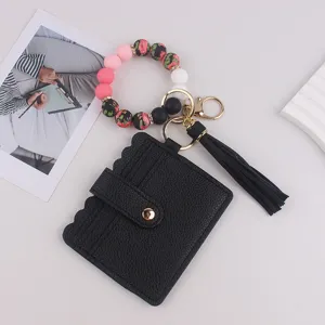 Schwarzes PU-Leder Kartenetui Schlüsselanhänger mit Silikonperlen Armband und Quaste für Damen.