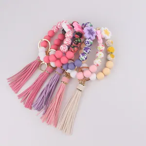 Silikon Perlen Armband Schlüsselanhänger mit Blumen Anhänger und Lederquaste Accessoire