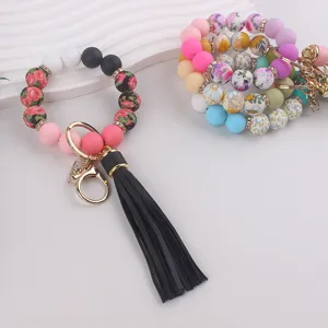 Pulsera llavero de cuentas de silicona con borla, anillo de llave colorido para mujeres.