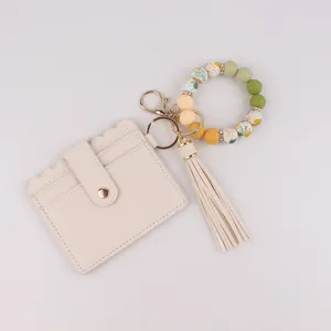 Damen Leder Kartenetui Brieftasche mit Silikonperlen Armband Schlüsselanhänger und Quaste.