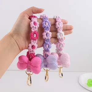 Handmade woven flower phone charm keychain with cute cotton bow and metal lobster clasp.